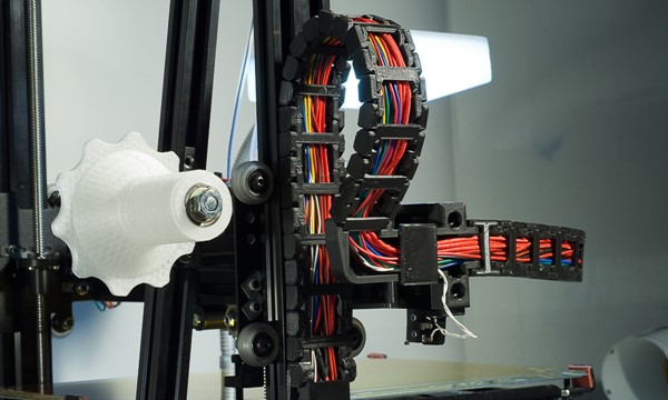 The MendelMax 3 3D printer - The cable chain on the left side of the printer showing its connection to the X axis