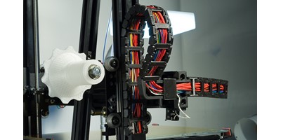 The MendelMax 3 3D printer - The cable chain on the left side of the printer showing its connection to the X axis
